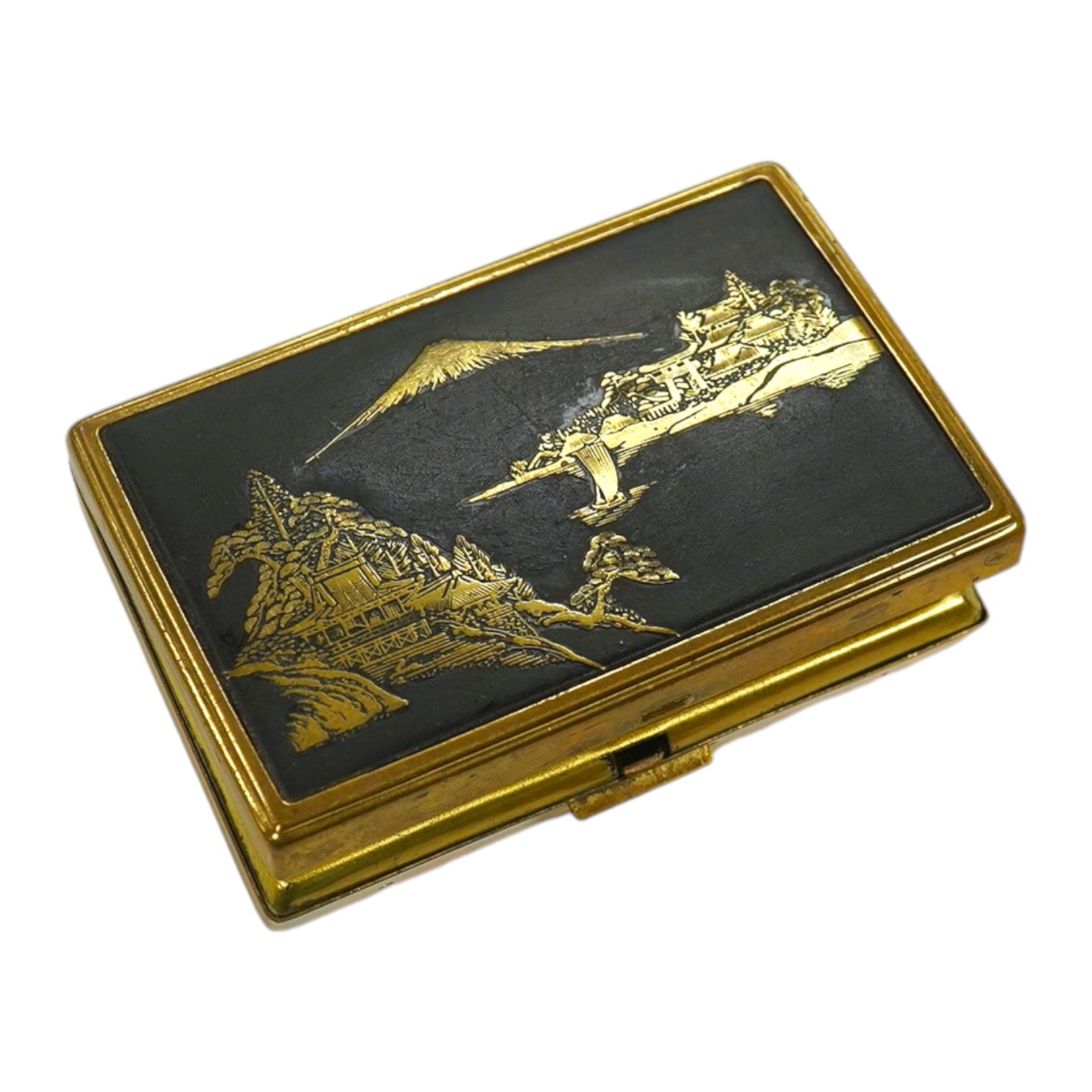 A Japanese damascened iron and gilt metal musical compact, 9cm wide. Condition - poor